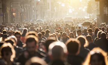 Crowd in the street with golden sunlight