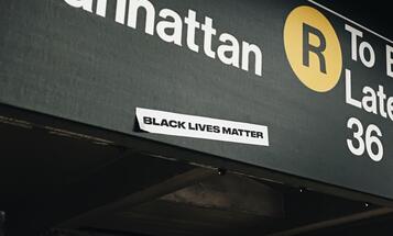 Black Lives Matter sticker on MTA subway sign